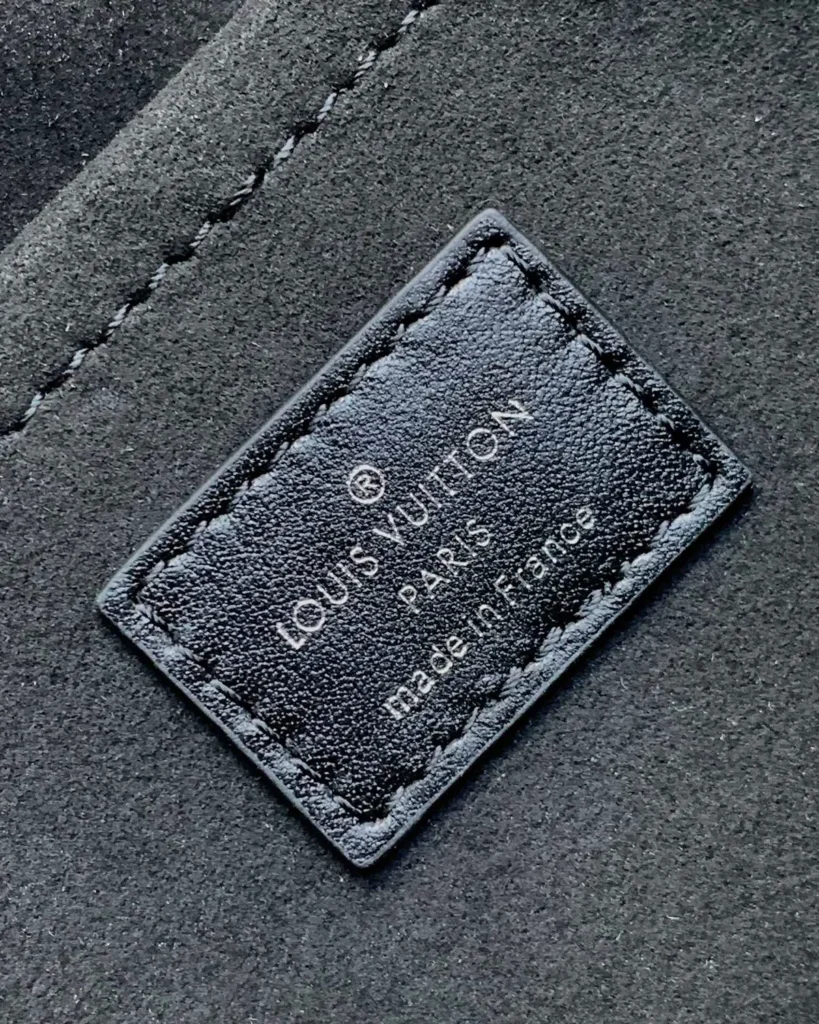 Black Gathered Flap Shoulder Bag — interior label view