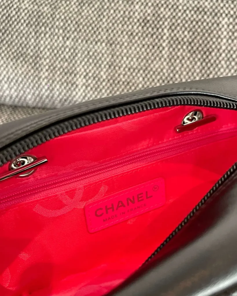 Black Quilted Offset-Emblem Bowler Bag — interior view