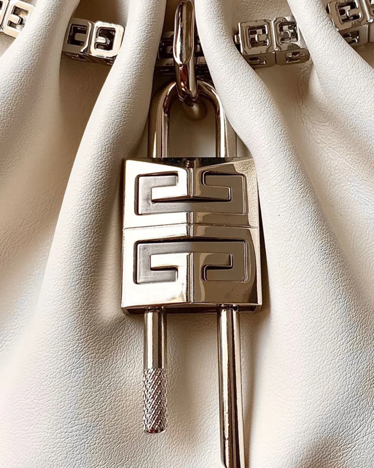 Ivory Ruched Chain Pouch — padlock detail