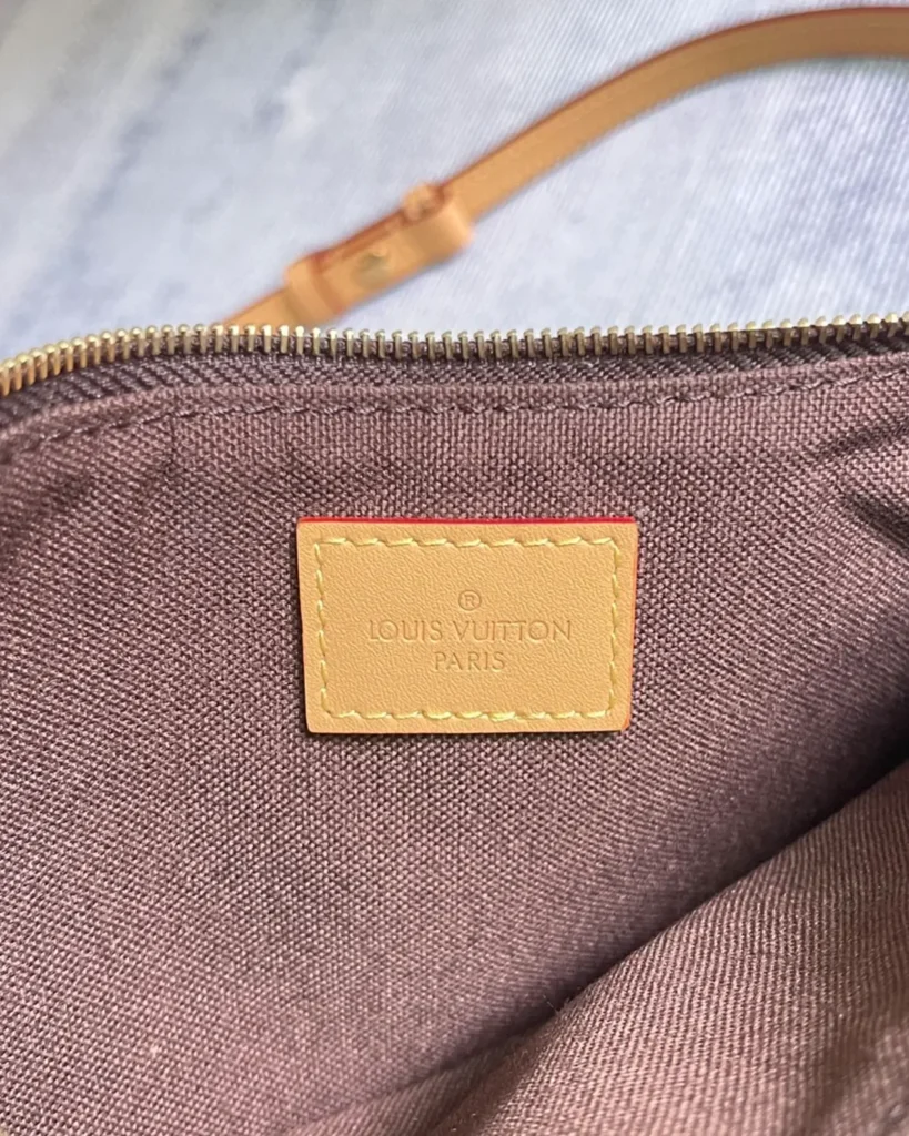 Brown Monogram Curved Zip Chain Pouch — interior label view