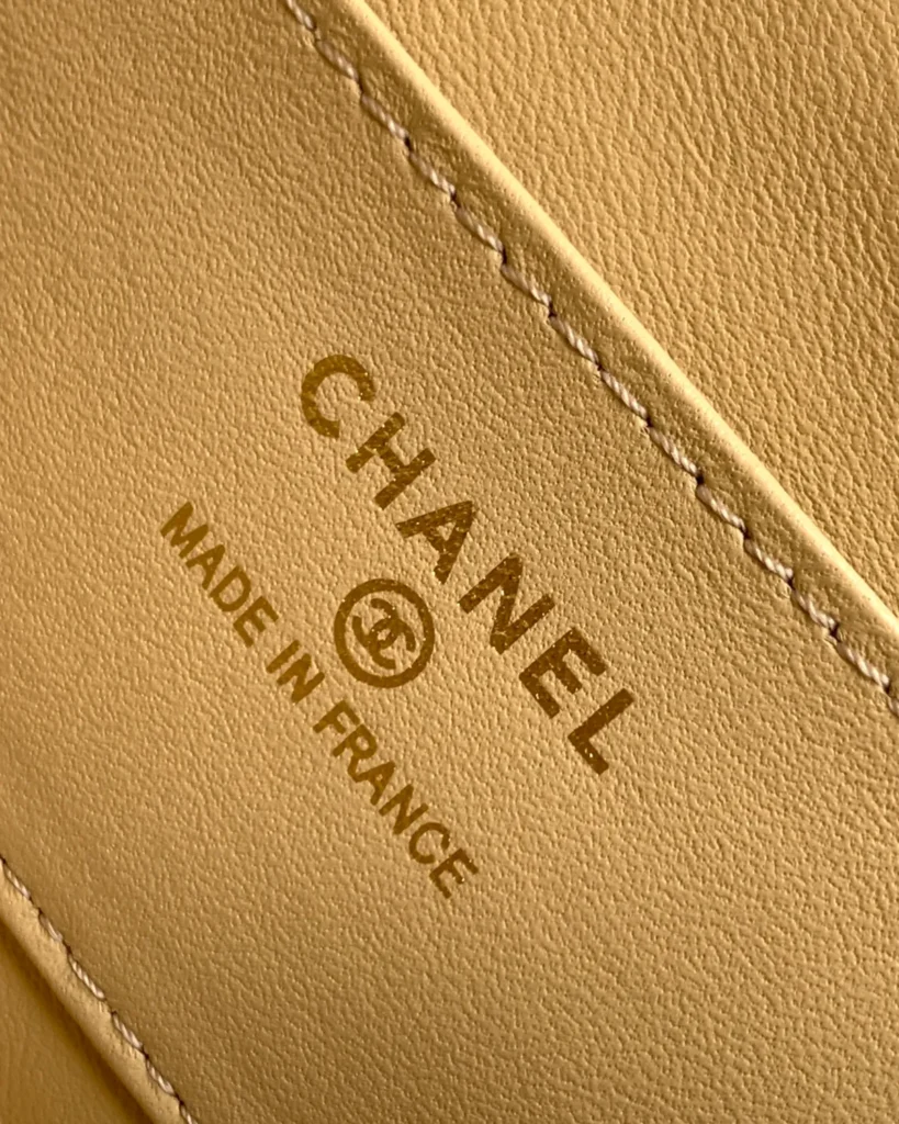 Tan and Black Quilted Flap Shoulder Bag — interior label view