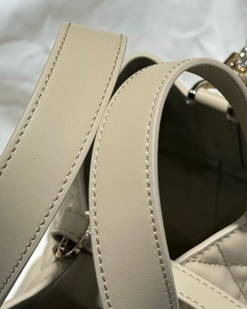 Sage Beige Vertical Quilted Tote — strap detail view