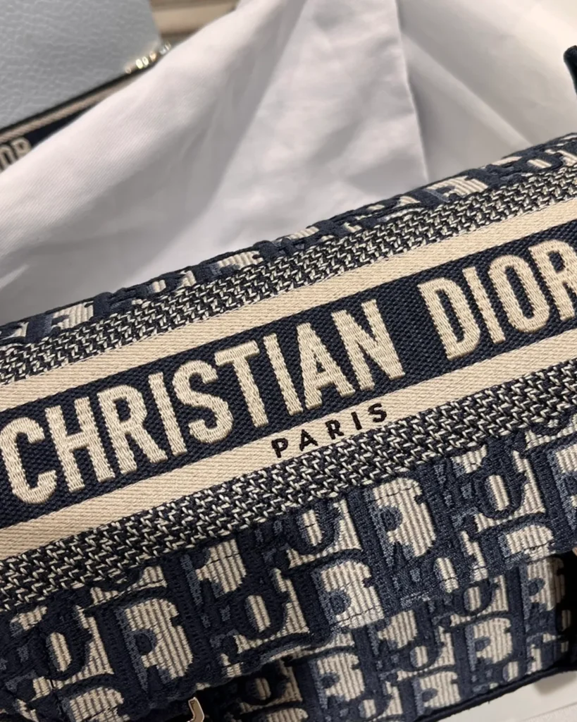 Navy Monogram Twin-Clasp Messenger Bag — lettering detail view