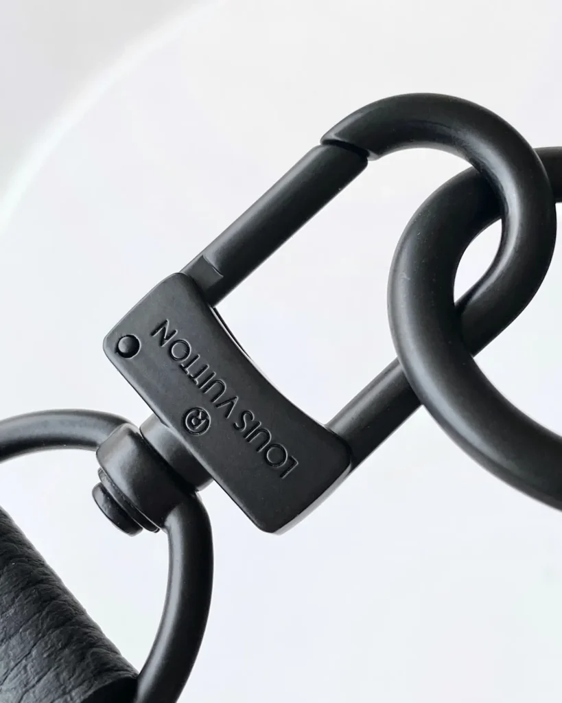 Black Grained-Look Duffle Bag — clasp detail view