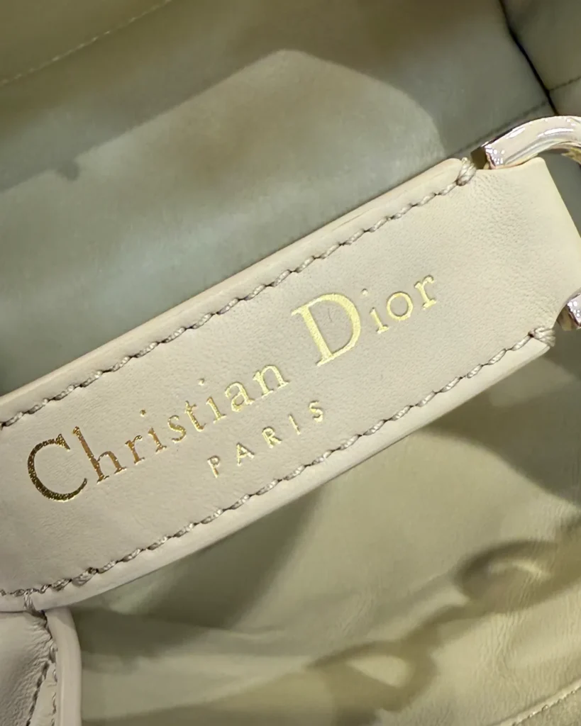 Sage Beige Vertical Quilted Tote — interior label view