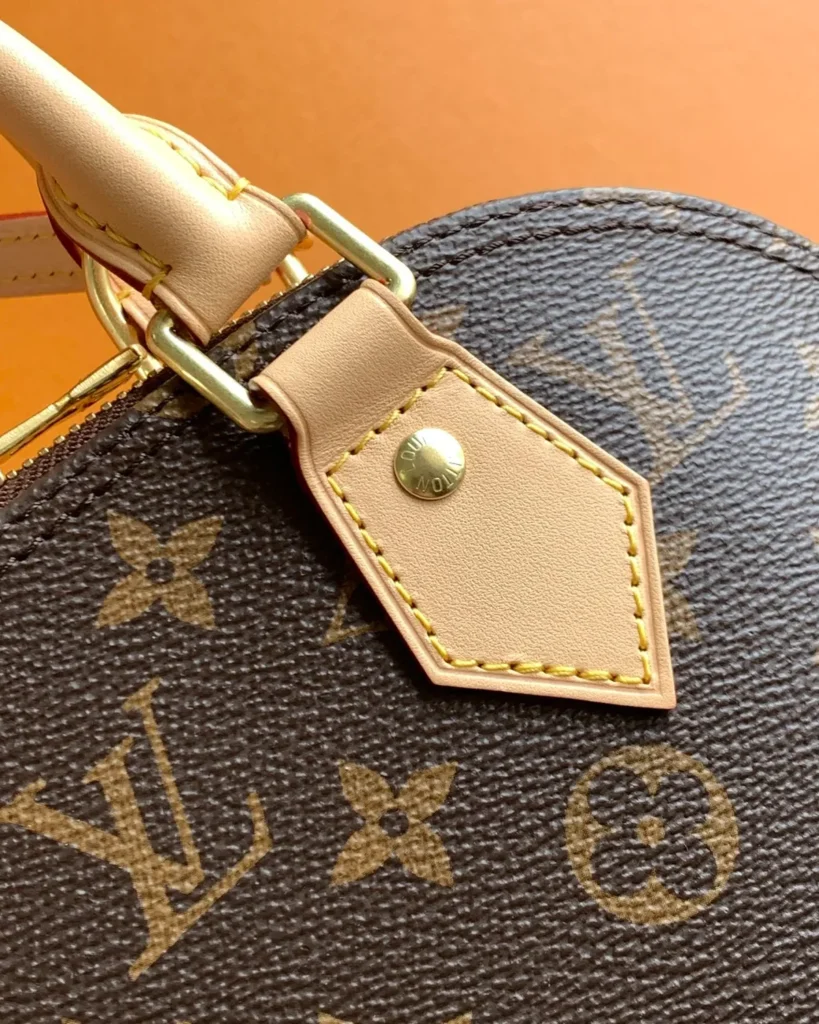 Brown Monogram Dome Satchel with Pale Trim — handle tab view