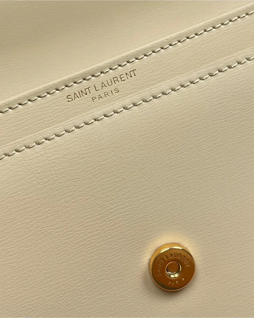 Cream Top-Handle Accordion Flap Bag — interior detail view