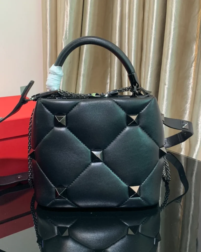 Black Diamond-Quilted Studded Top-Handle Bag — rear view