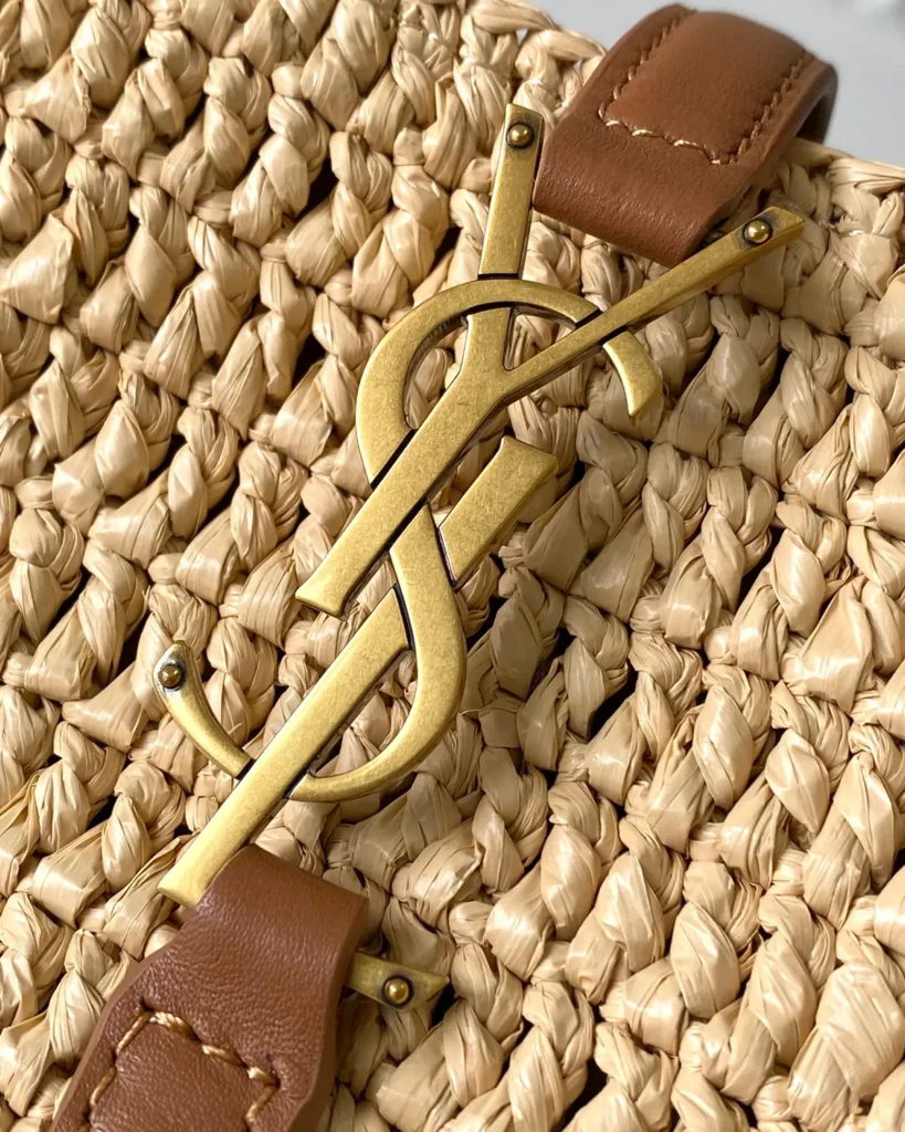 Straw-Tone Woven Bucket Bag with Tan Trim — logo detail view