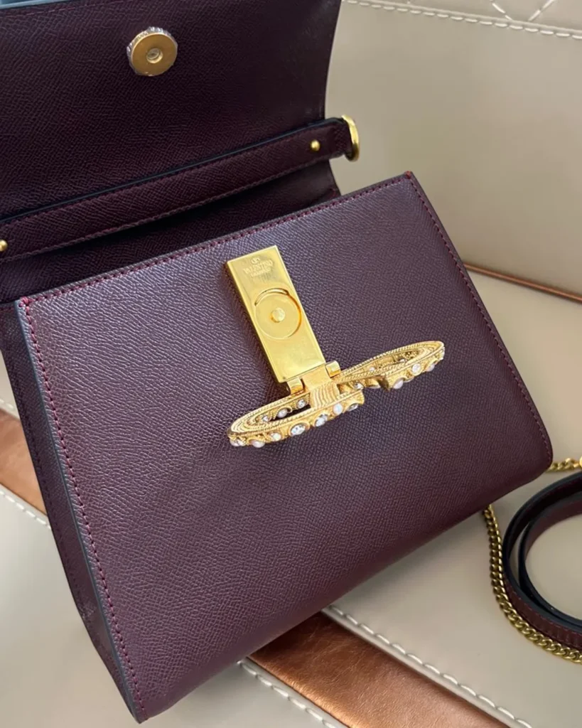 Burgundy Pearl-Effect Emblem Top-Handle Bag — open flap view