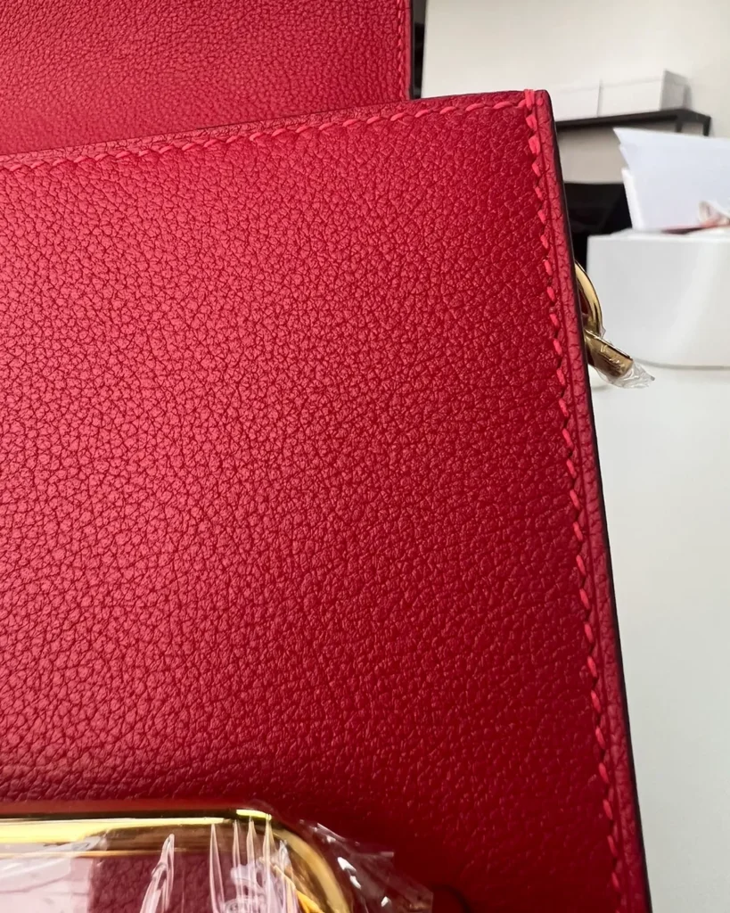 Red roulis-inspired mini bag, texture detail view