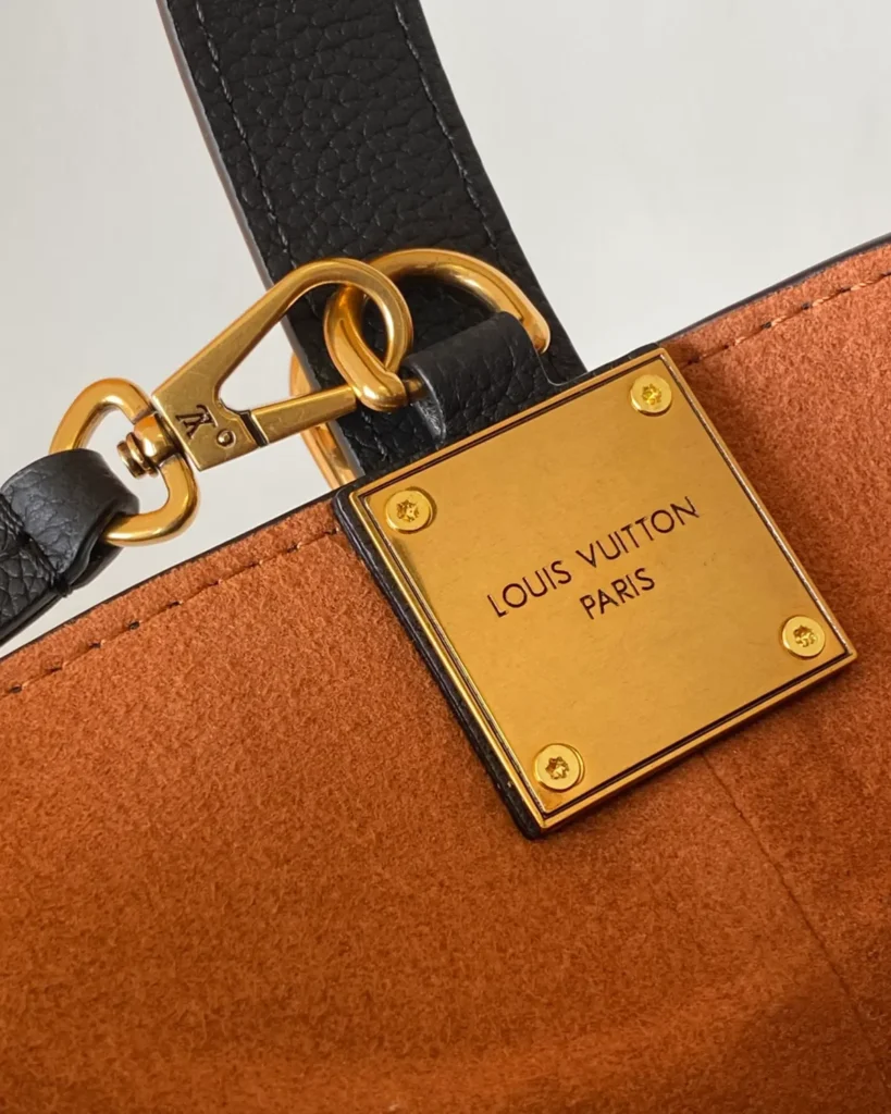 Black Curved Top Bucket Bag with Padlock — interior hardware view