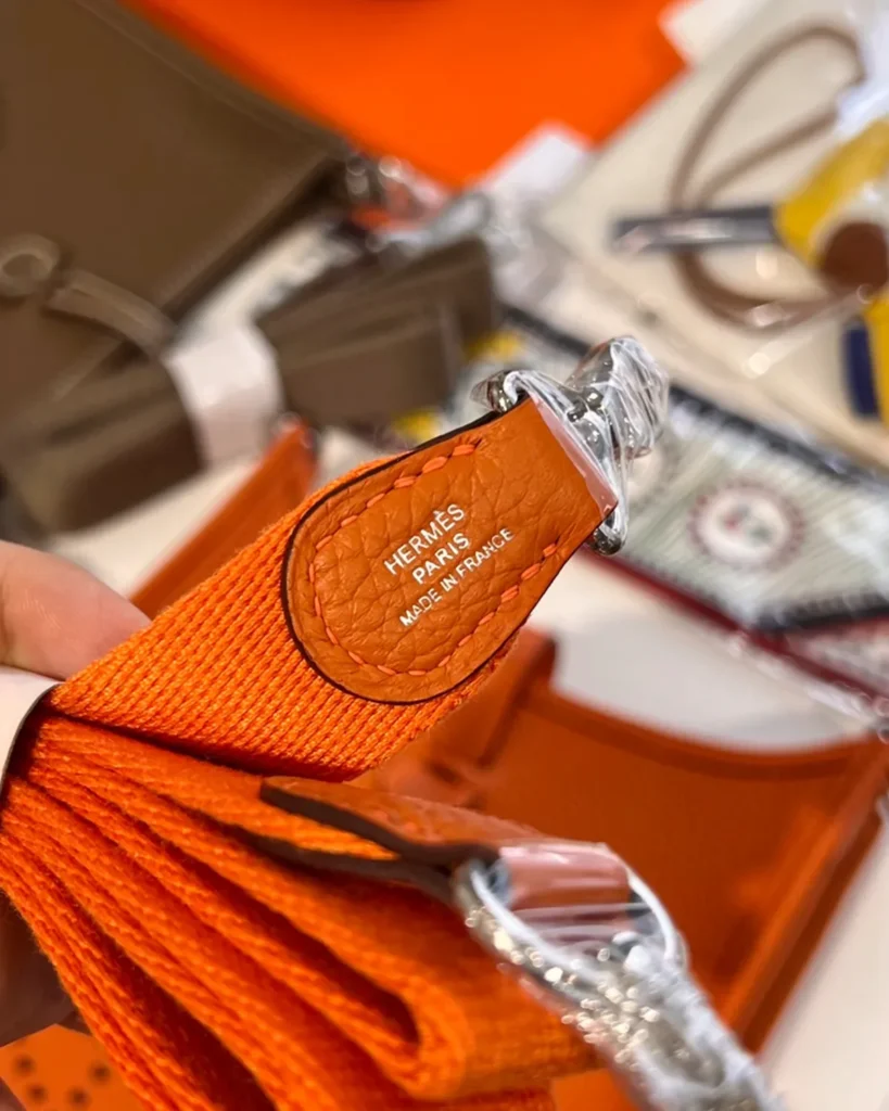 Evelyne-Inspired Mini Orange Crossbody Bag, woven strap ends and clips