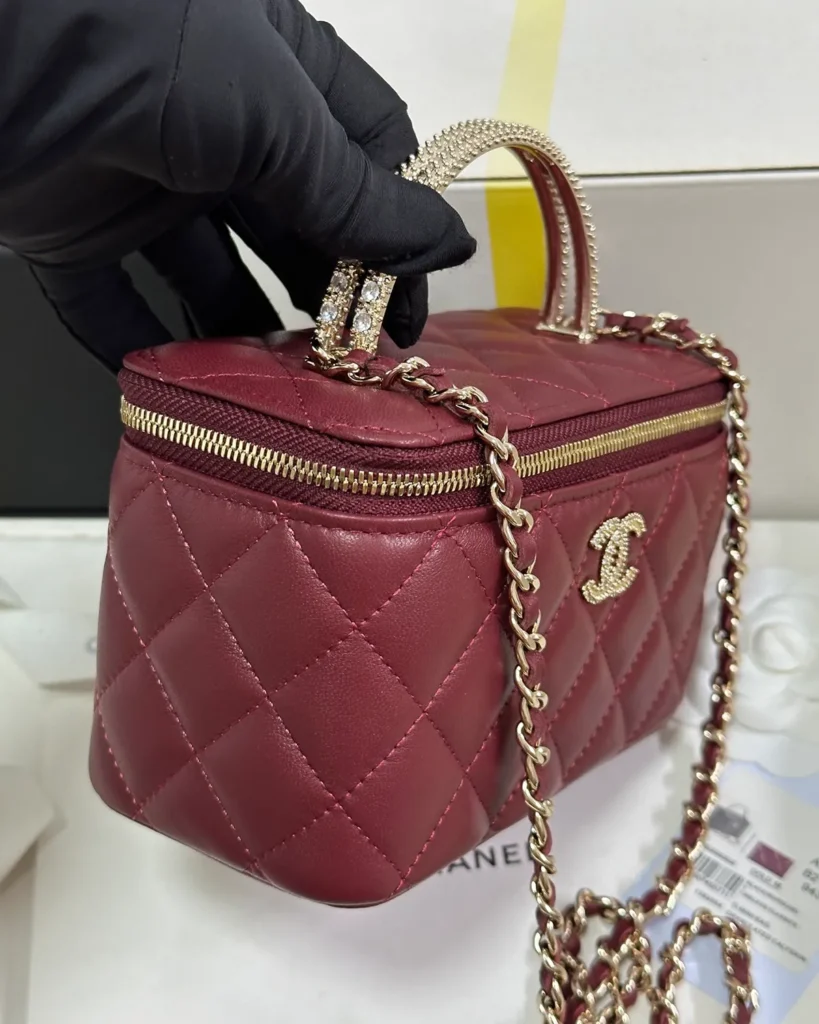 Burgundy Quilted Ornamental-Handle Vanity Bag — side view