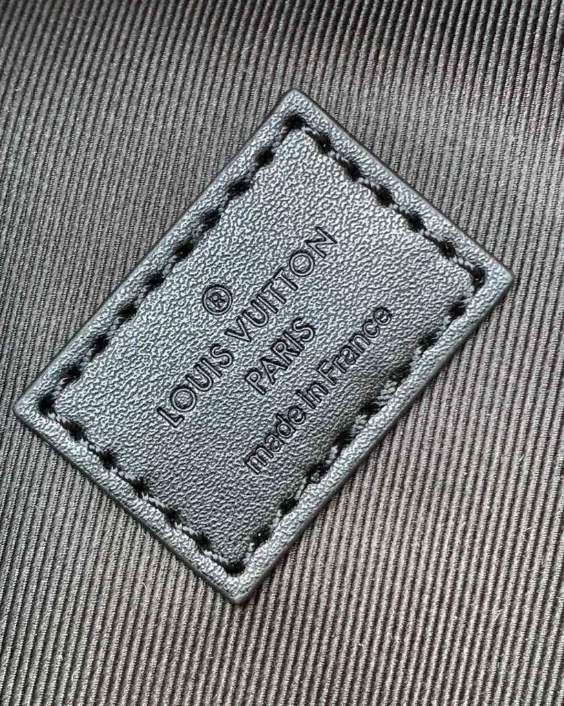 Brown Monogram Discovery-Inspired Backpack — interior label view