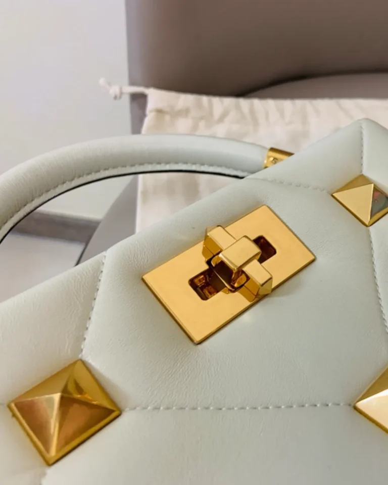 Ivory Diamond-Quilted Studded Top-Handle Bag — closure detail view