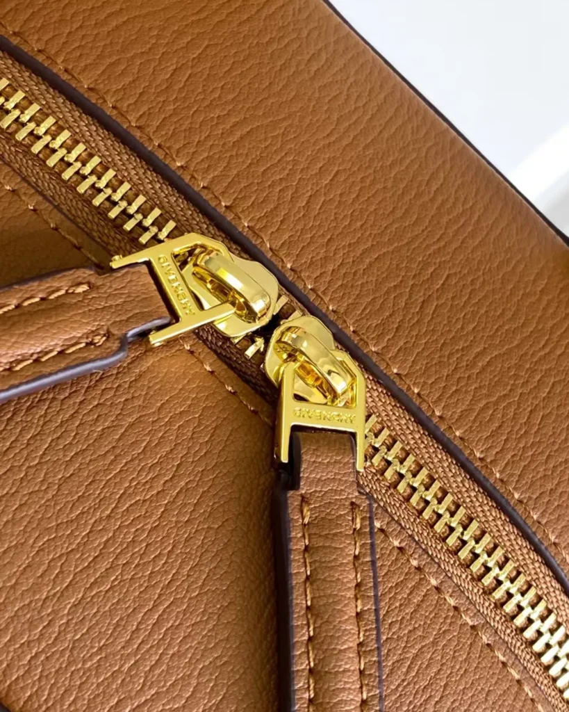 Tan Domed Top Handle Bag — zip detail view