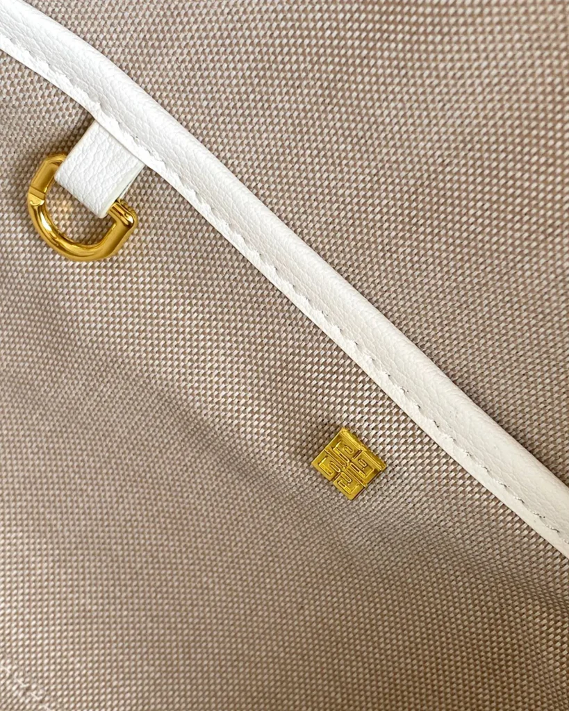 White Domed Top Handle Bag — interior fitting view