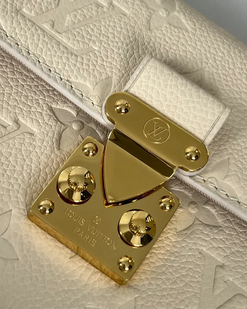Cream Embossed Flap Chain Wallet — clasp view