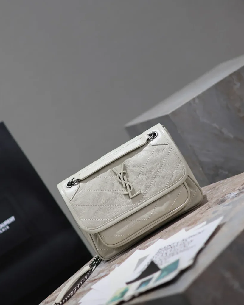 Ivory Crinkled Chevron Chain Bag — angled front view