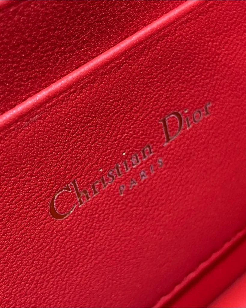 Red Quilted Top Handle Flap Bag — interior stamp view