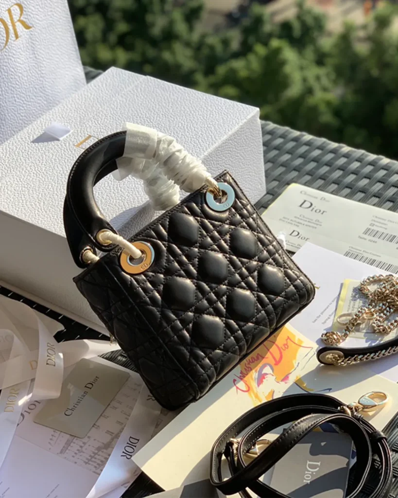 Black Quilted Compact Top Handle Bag — rear view
