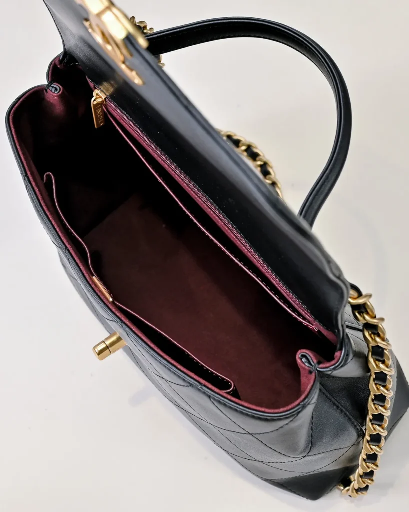Black Quilted Top-Handle Flap Bag — open interior view