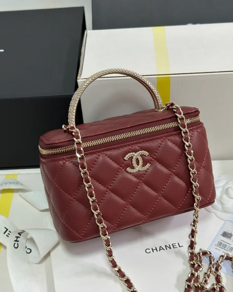 Burgundy Quilted Ornamental-Handle Vanity Bag — front view