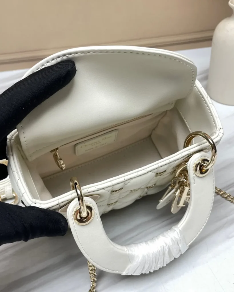 Ivory Butterfly Stud Quilted Top Handle Bag — interior view