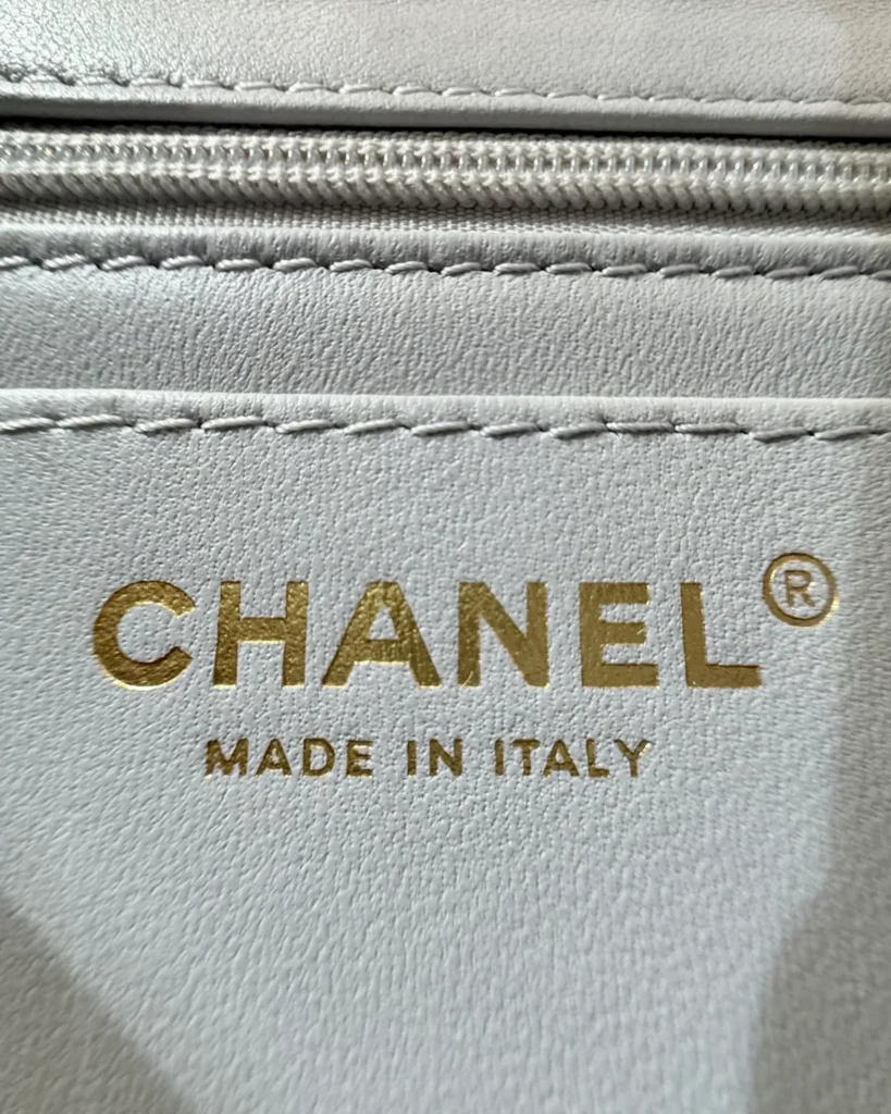 Pale Grey Quilted Top-Handle Flap Bag — interior label view