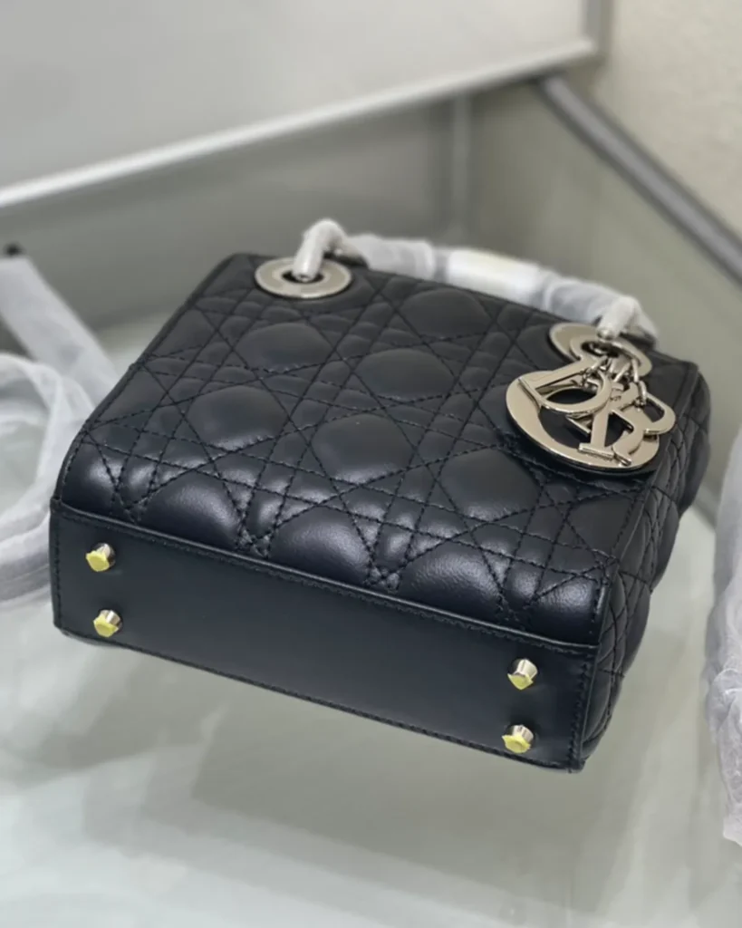 Black Quilted Top Handle Bag with Silver-Tone Charms — base view