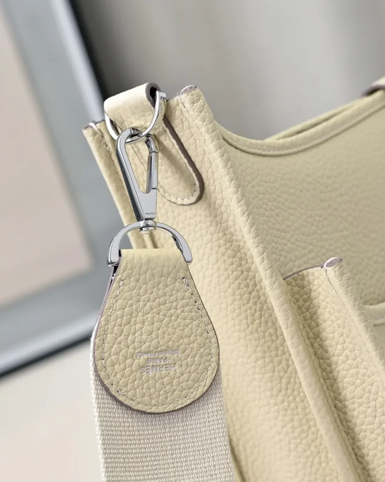 Evelyne-Inspired Ivory Perforated Shoulder Bag, strap clip attachment close-up
