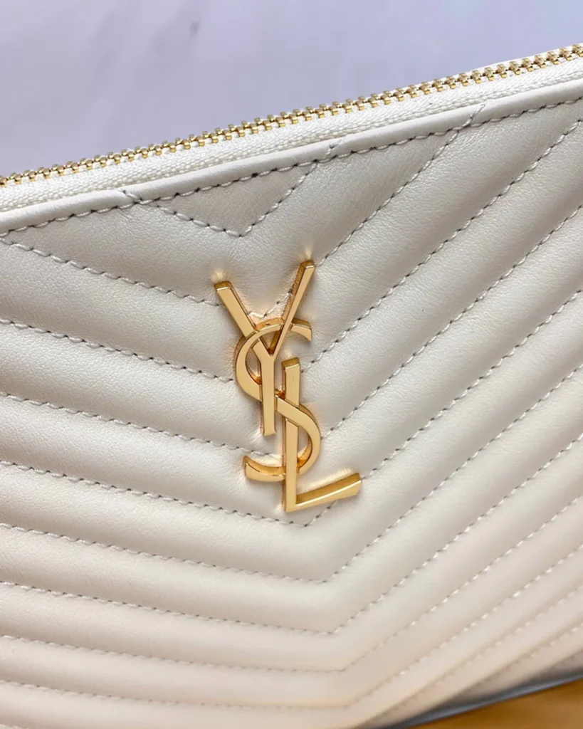 Ivory Chevron Zip Wristlet Pouch — logo detail view