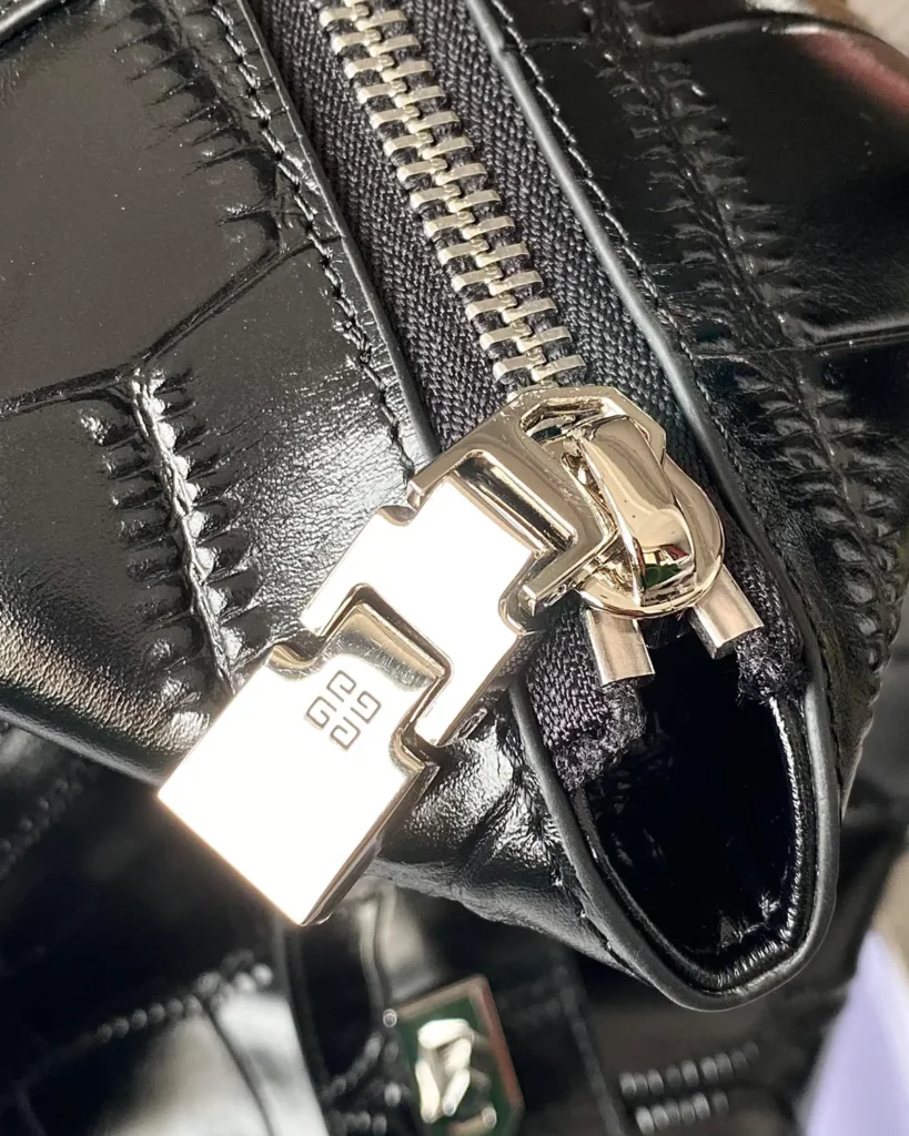 Black Scale-Pattern Padlock Handbag — zipper detail