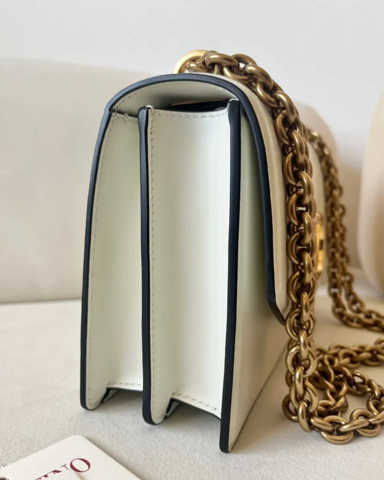 Ivory Curved-Flap Chain Shoulder Bag — side view