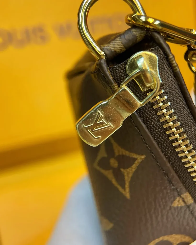 Brown Monogram Mini Chain Zip Pouch — zipper detail view