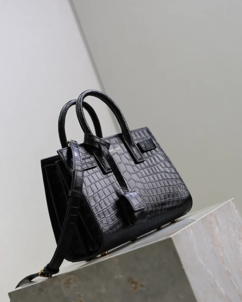 Black Embossed Accordion Tote — angled rear view