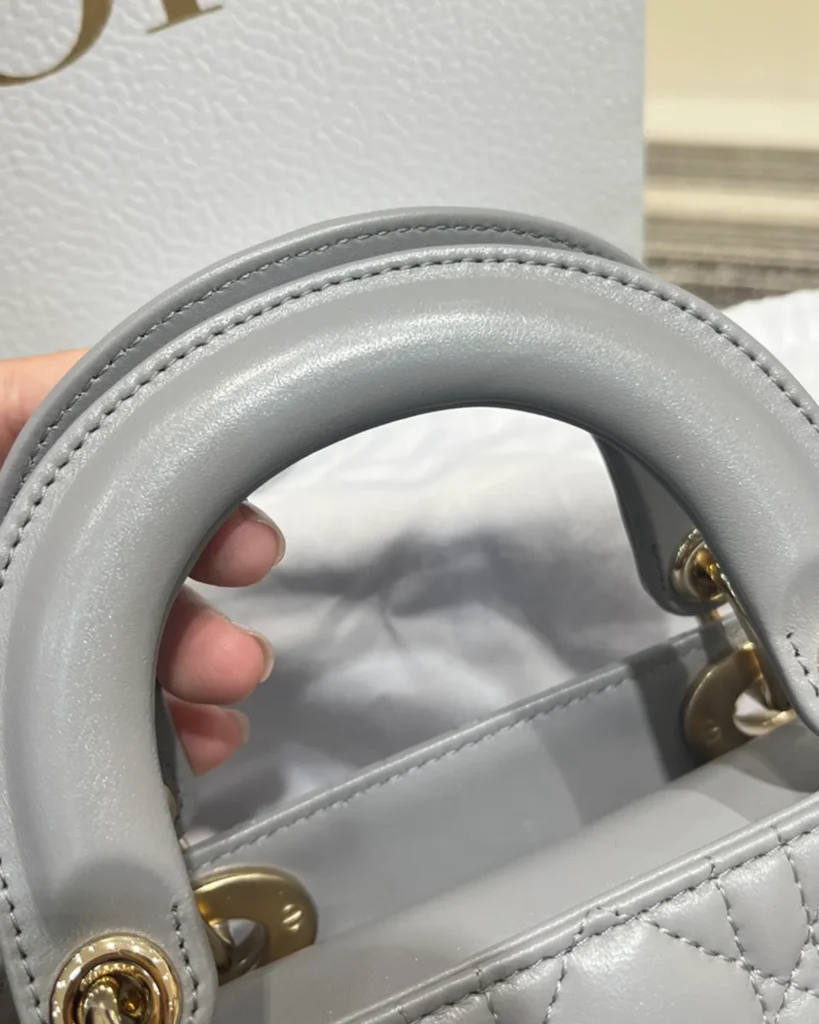 Pearlescent Gray Quilted Top Handle Bag — handle detail view