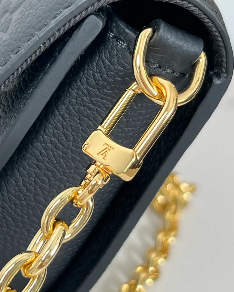 Black Embossed Flap Chain Wallet — chain clip view