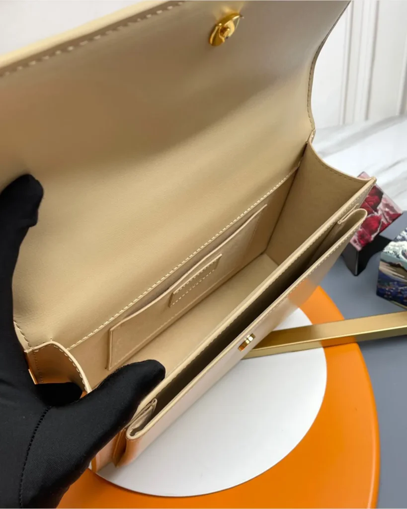 Cream Top-Handle Accordion Flap Bag — interior view