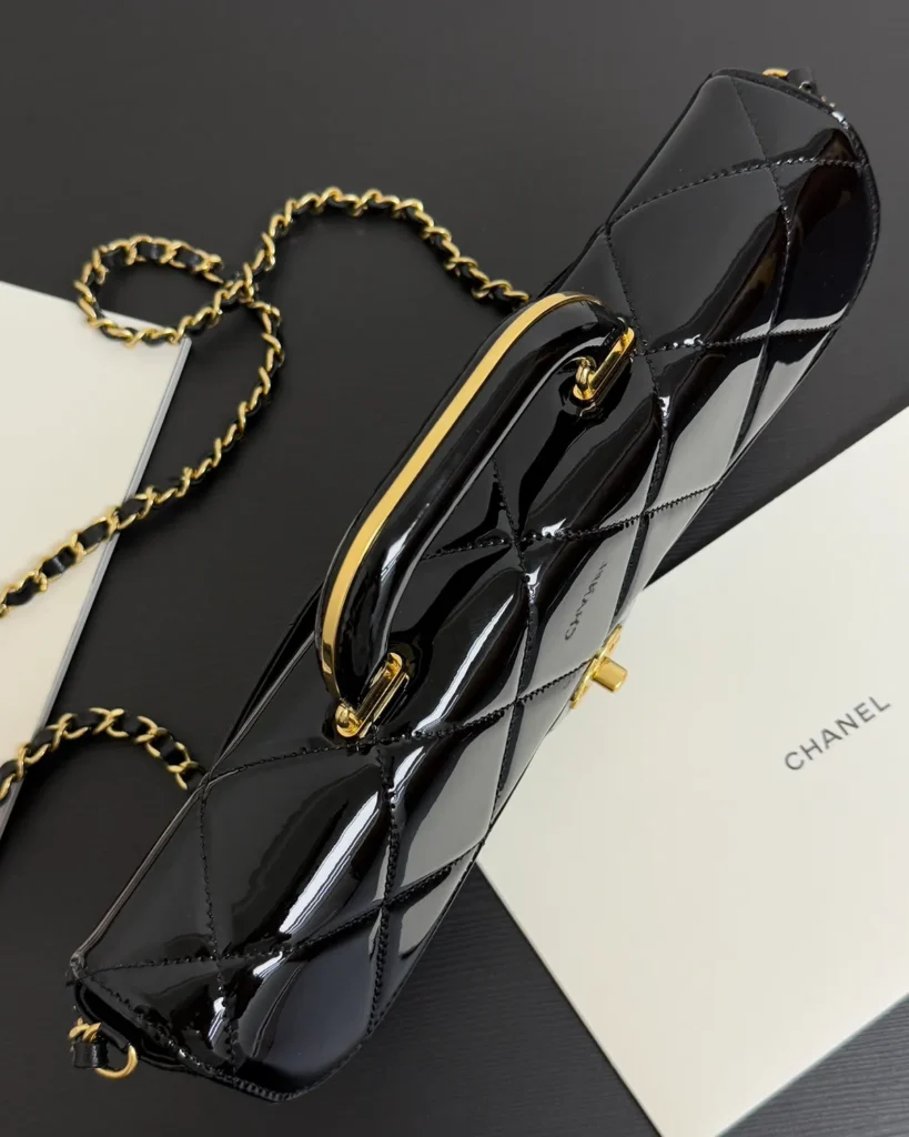 Glossy Black Quilted Handle Clutch — top view