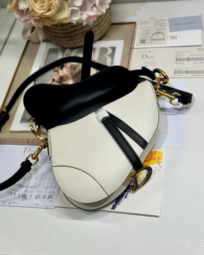 Cream and Black Asymmetric Saddle Bag — open flap view
