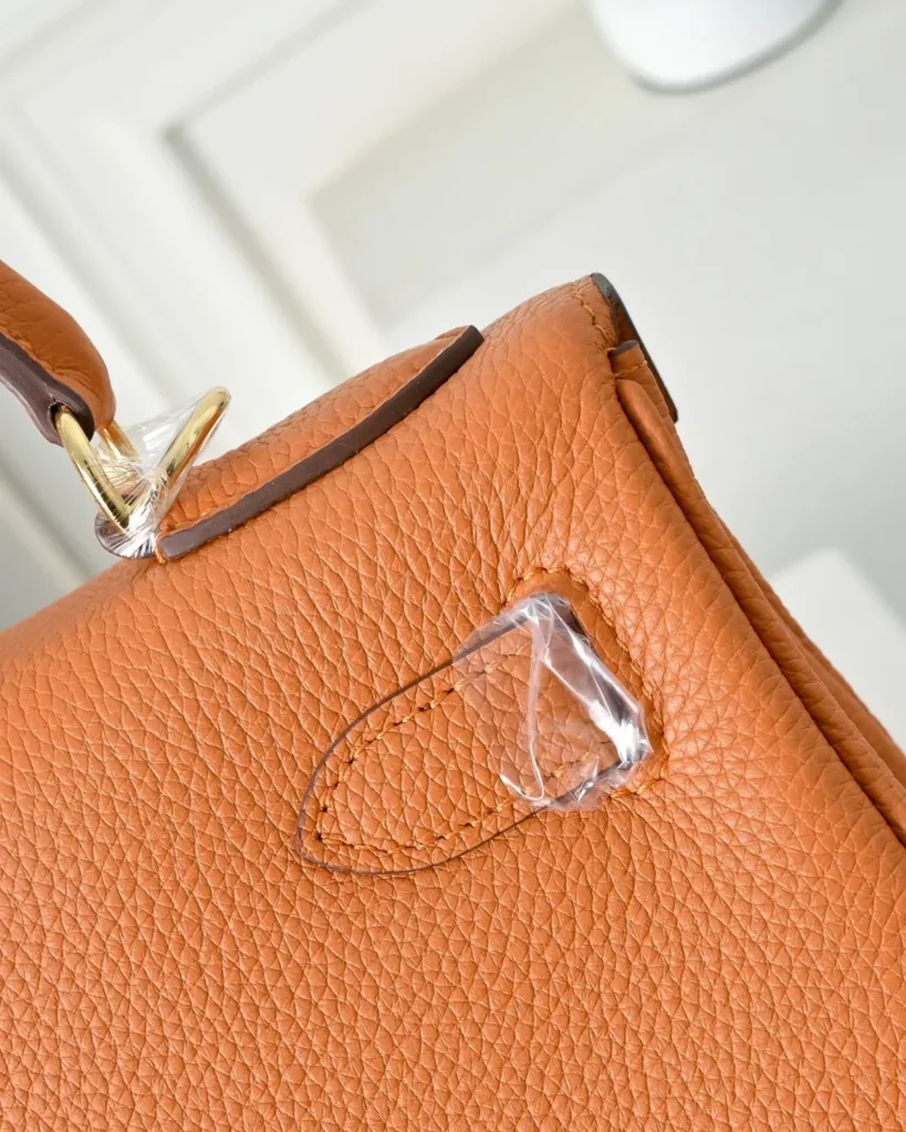 Kelly-Inspired 28 Orange Structured Top-Handle Bag, rear handle tabs