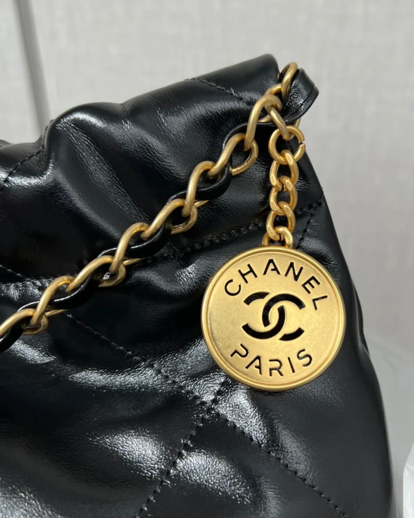 Glossy Black Quilted Chain Shopper — chain detail view