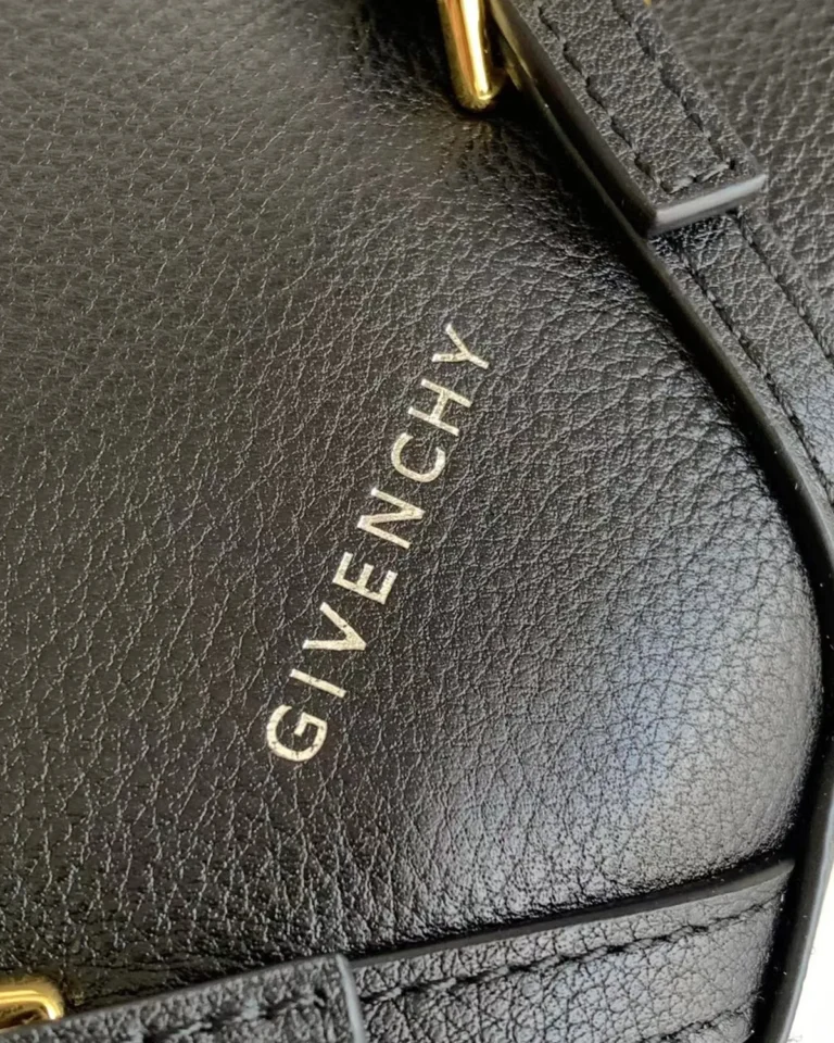 Black Draped-Top Buckle Shoulder Bag — logo detail