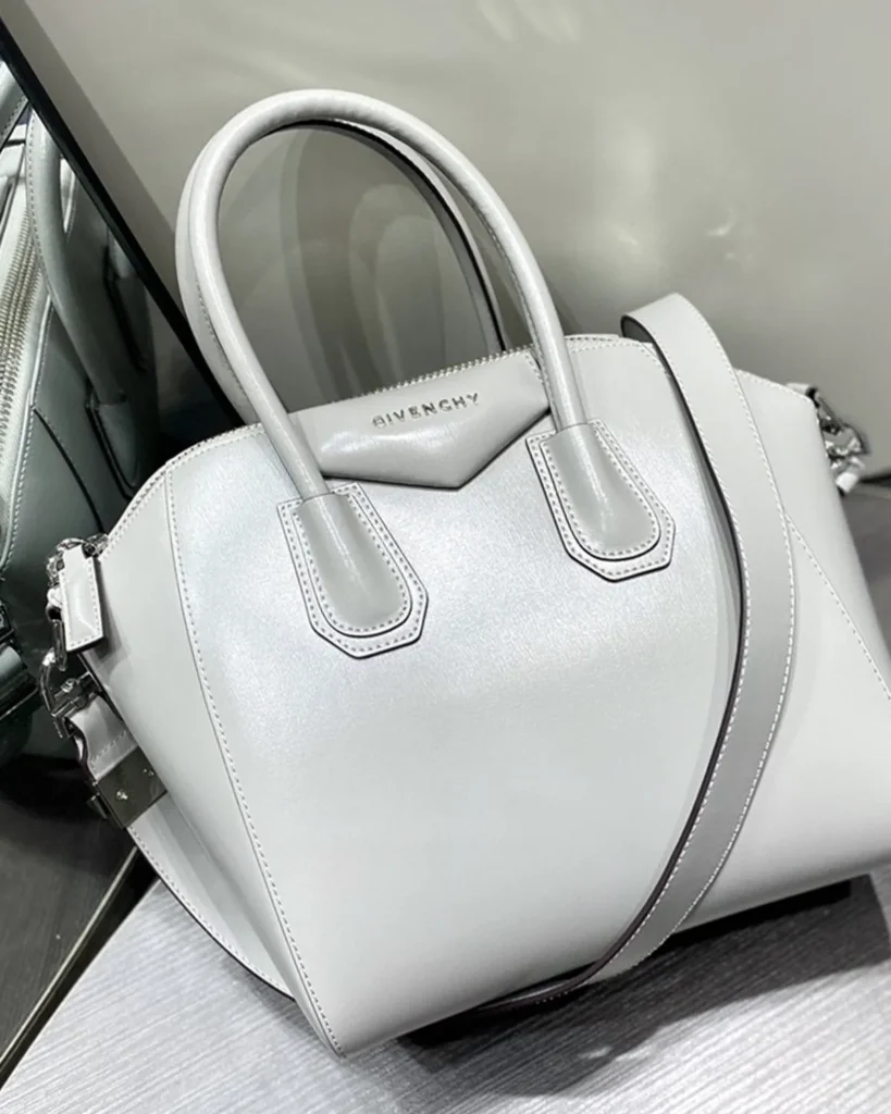 Pale Grey Architectural Top Handle Bag — front strap view