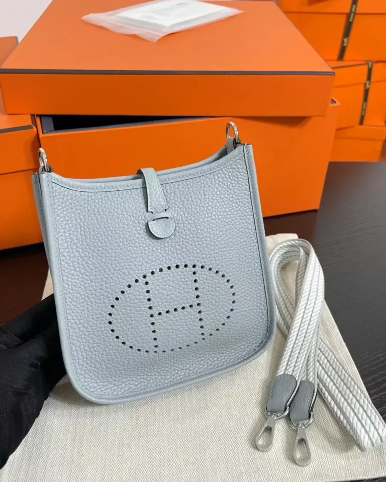 Evelyne-Inspired Mini Flax Blue Crossbody Bag, angled front with strap clips