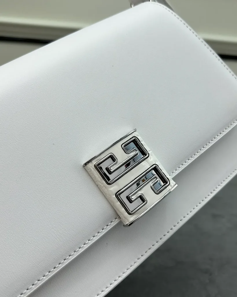 White Geometric Clasp Flap Bag — clasp detail