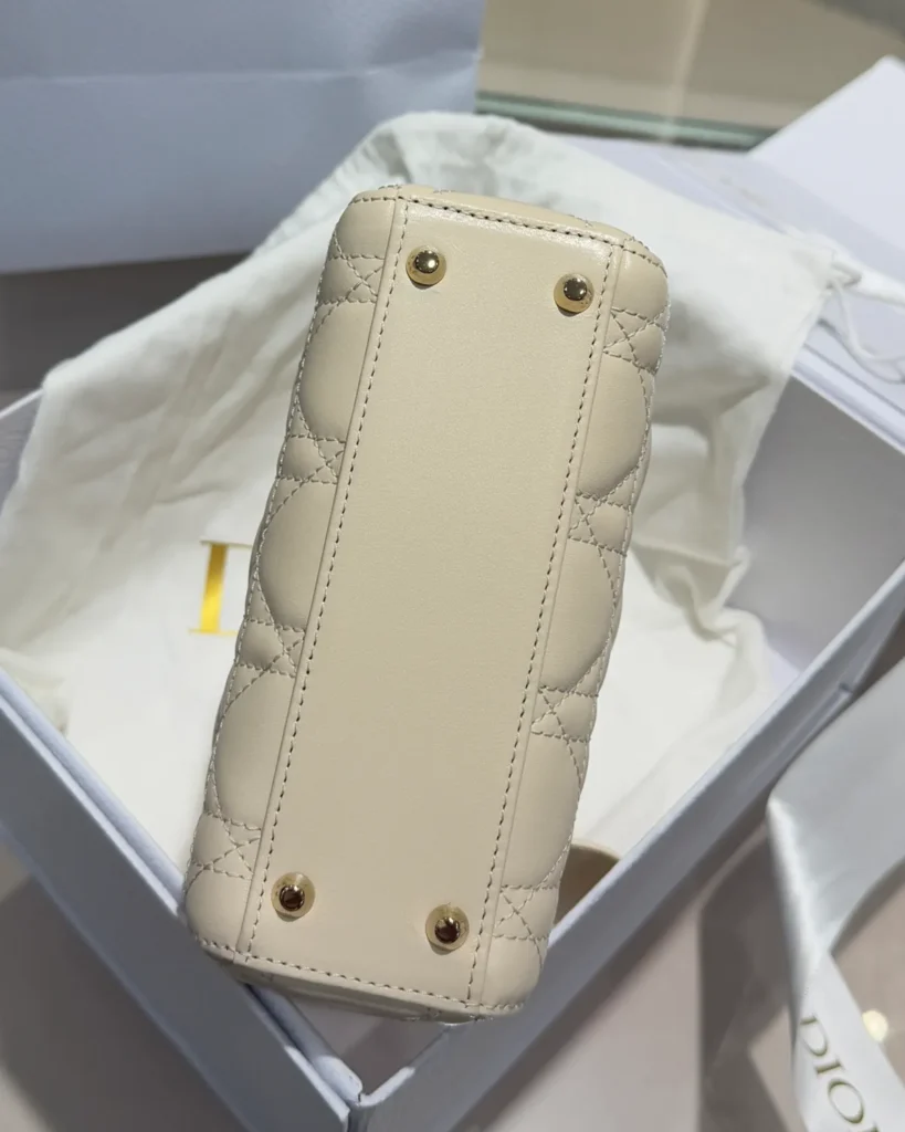 Cream Quilted Top Handle Bag with Sparkling Charms — base view