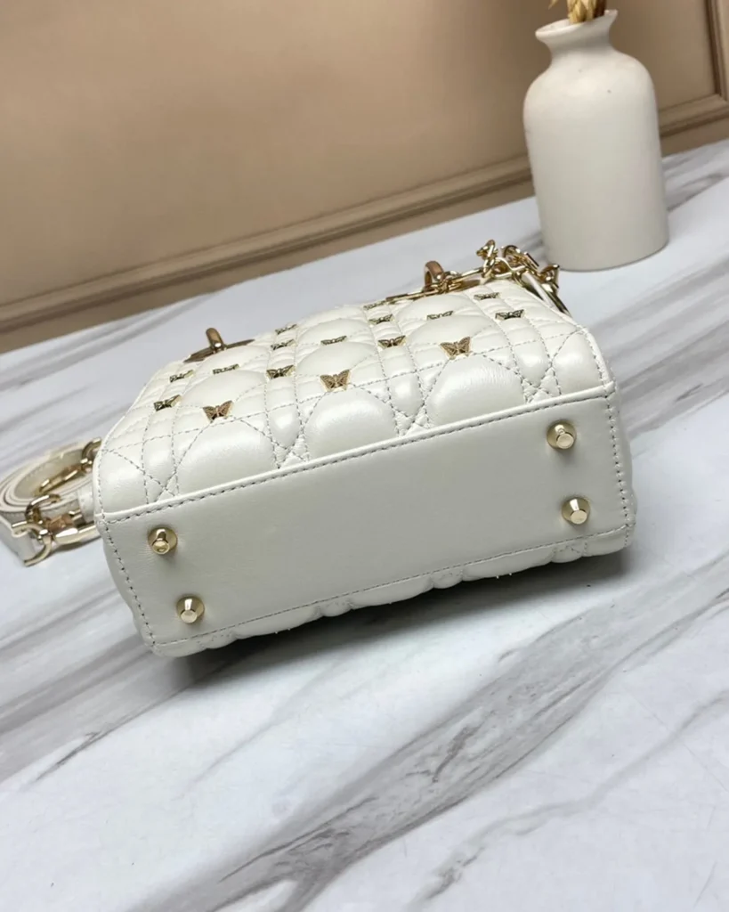 Ivory Butterfly Stud Quilted Top Handle Bag — base view